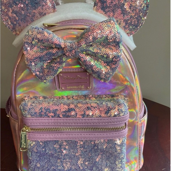 Loungefly Handbags - - DISNEY PARKS 50TH ANN .LOUNGEFLY EARIDECENT PINK BACKPACK